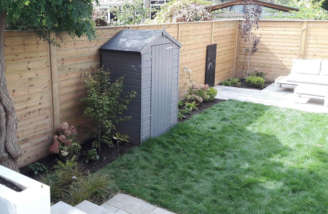 Shed amongst planting